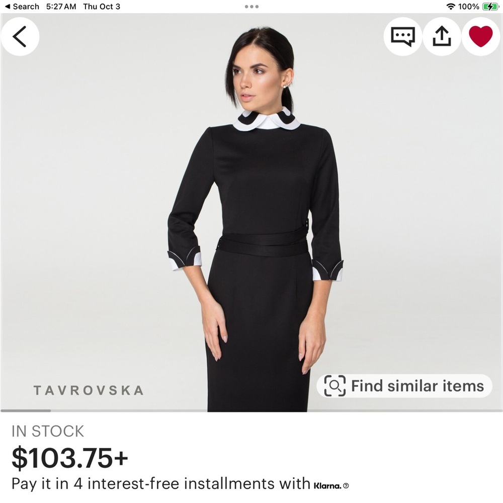 class black dress with Peter Pan collar.